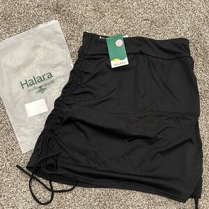 Brand new, never worn, woman’s size M golf/tennis skirt with shorts.
